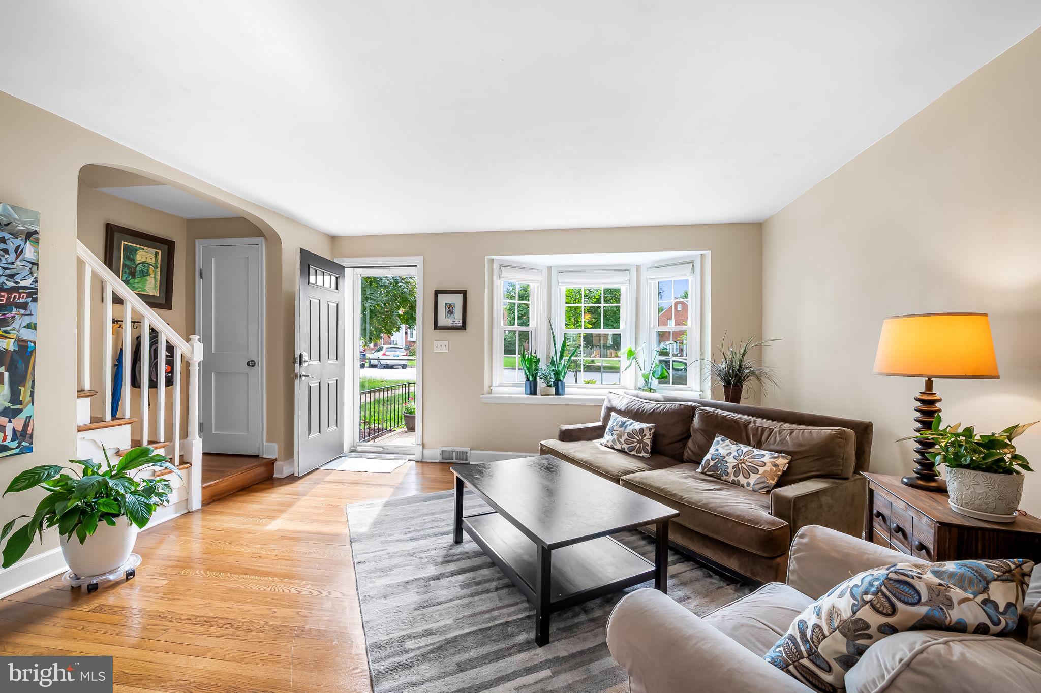 112 Regester Avenue Baltimore, MD 21212 - Photo 4 of 36 a living room with furniture and a potted plant