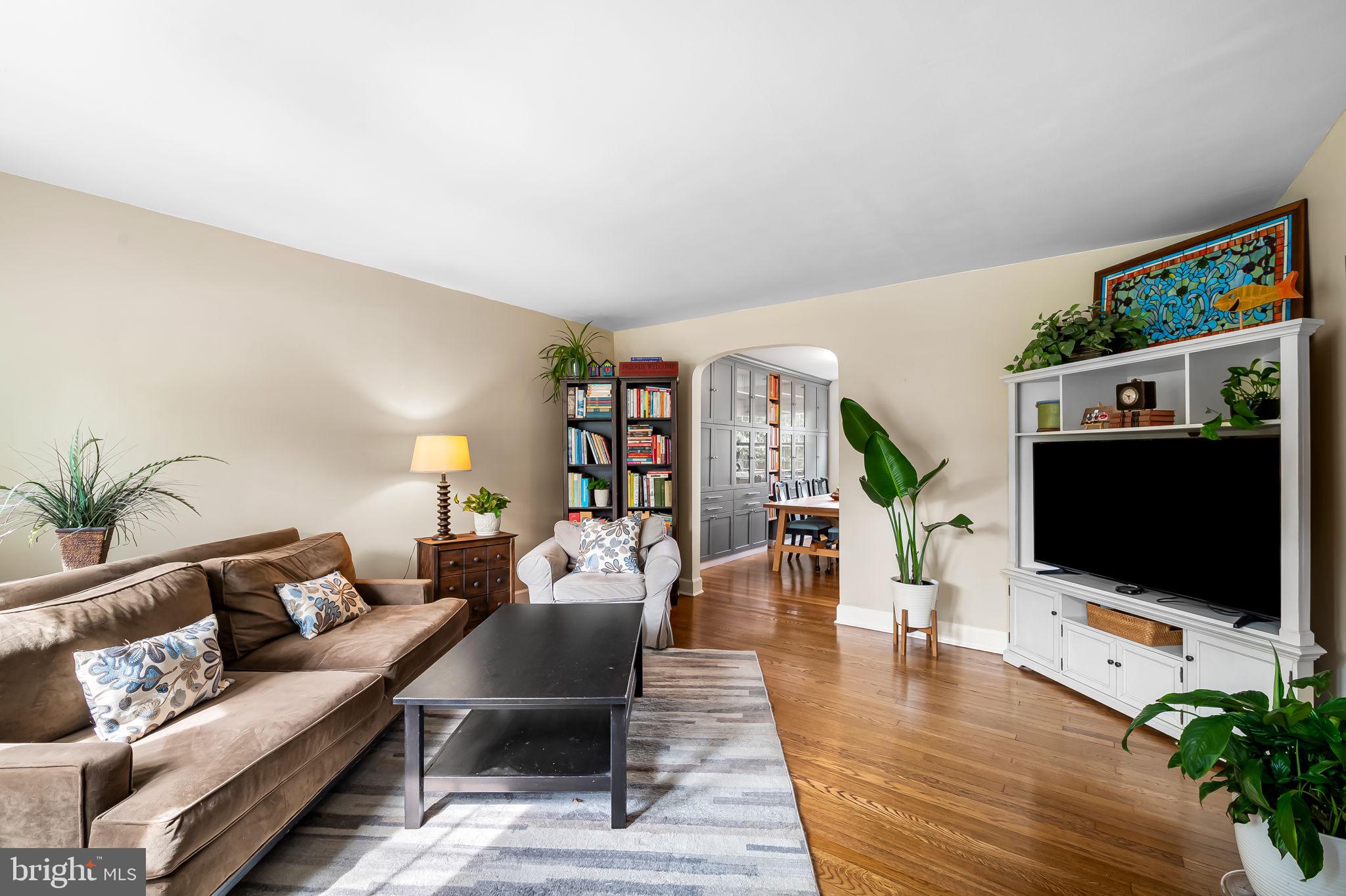 112 Regester Avenue Baltimore, MD 21212 - Photo 6 of 36 a living room with furniture and a flat screen tv