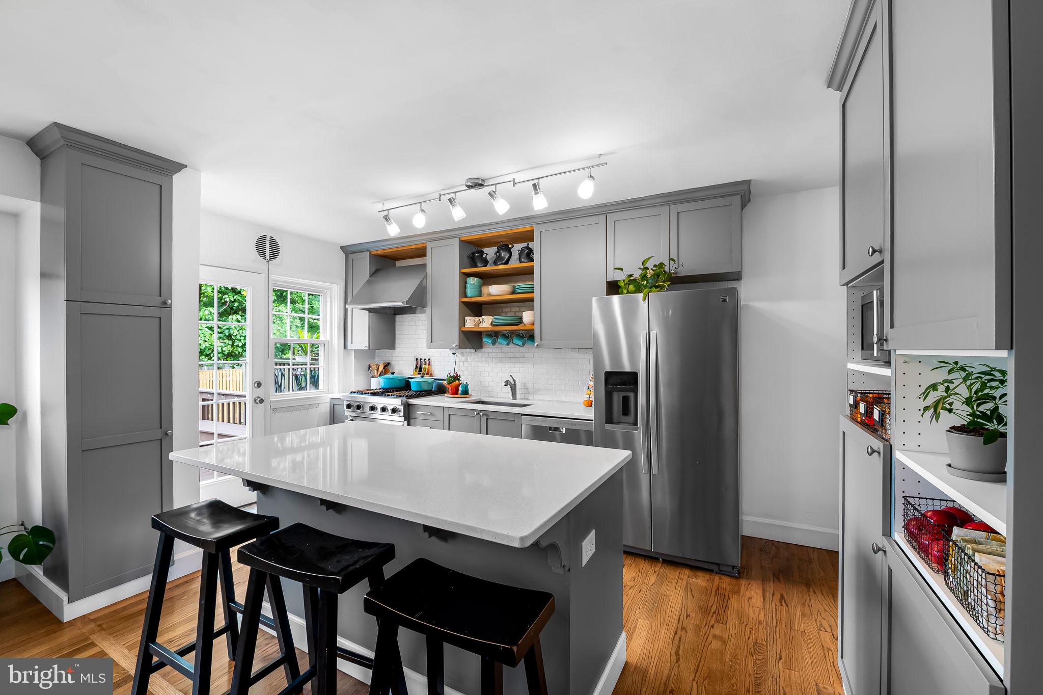 112 Regester Avenue Baltimore, MD 21212 - Photo 10 of 36 a kitchen with a table and chairs in it