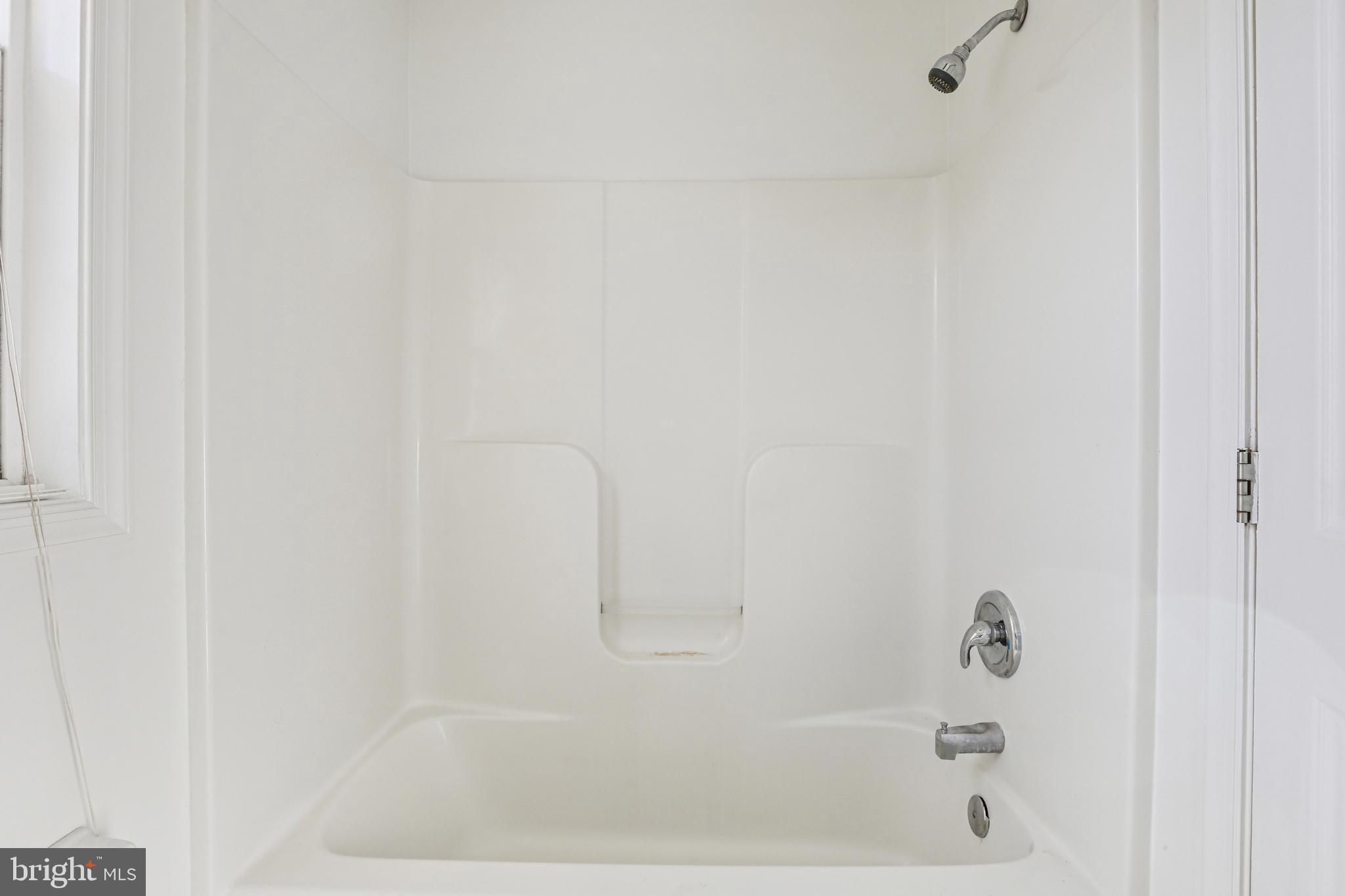 3924 Paul Mill Road Ellicott City, MD 21042 - Photo 14 of 51 a bathroom with a bathtub