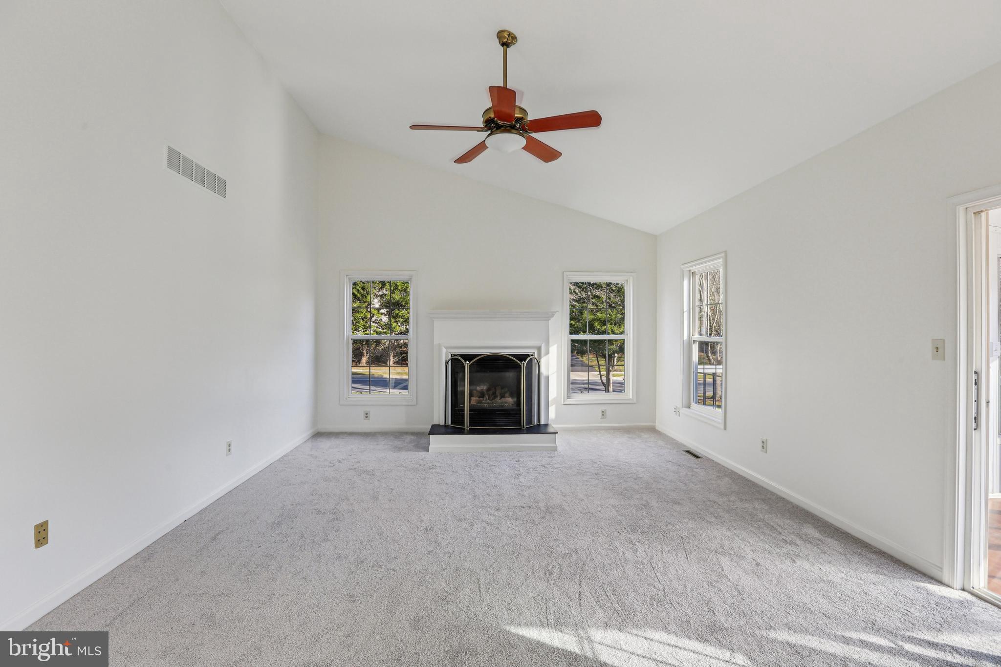 3924 Paul Mill Road Ellicott City, MD 21042 - Photo 3 of 51 a view of empty room with fireplace and fan