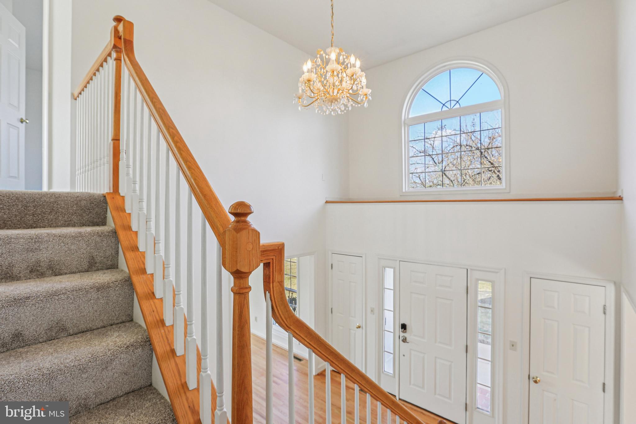 3924 Paul Mill Road Ellicott City, MD 21042 - Photo 34 of 51 a view of staircase with wooden floor and stairs