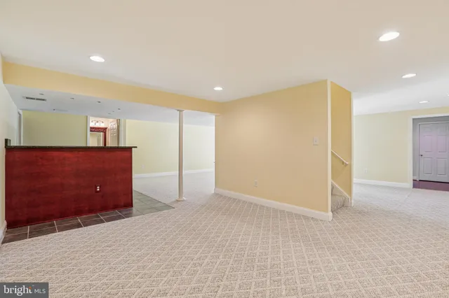 an empty room with a empty space and window