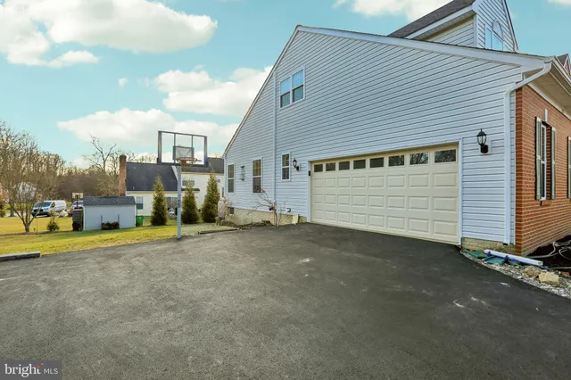 a view of a house with a wooden deck