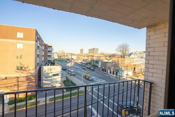 a view of a balcony with city