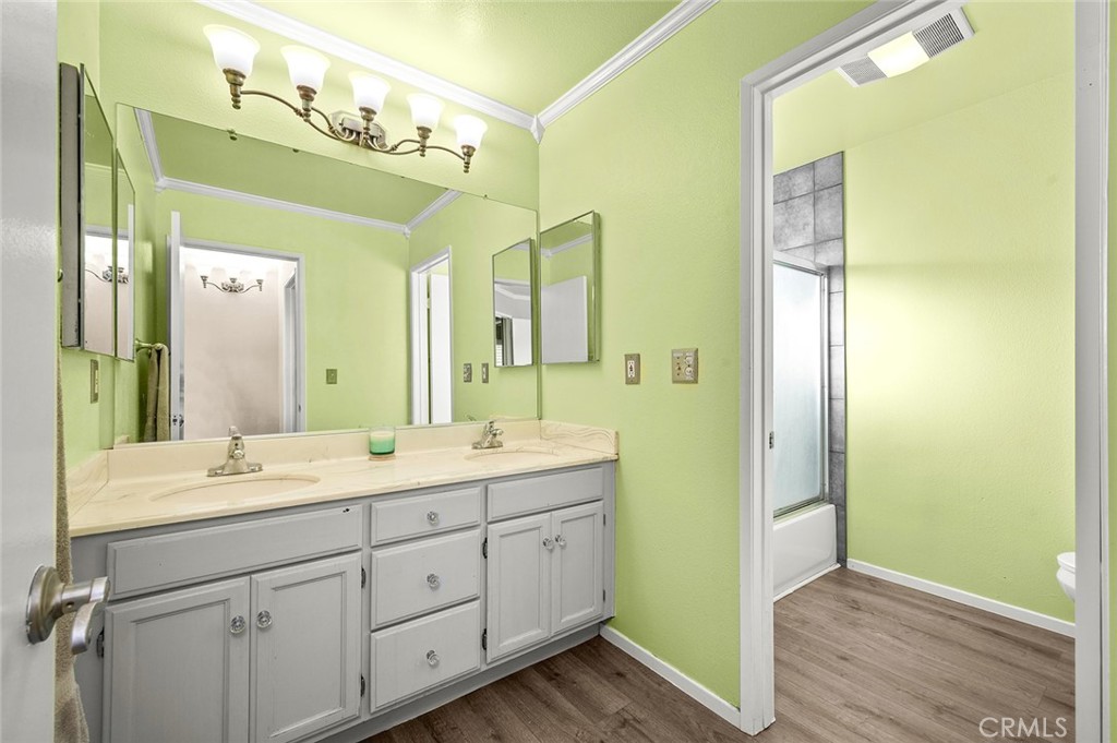 1790 North Encina Avenue Rialto, CA 92376 - Photo 23 of 47 a spacious bathroom with a double vanity sink and a mirror