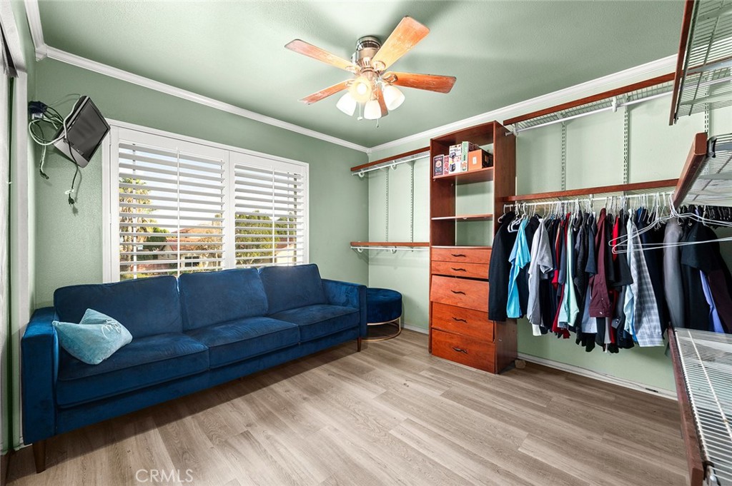 1790 North Encina Avenue Rialto, CA 92376 - Photo 25 of 47 a living room with furniture and a walk in closet