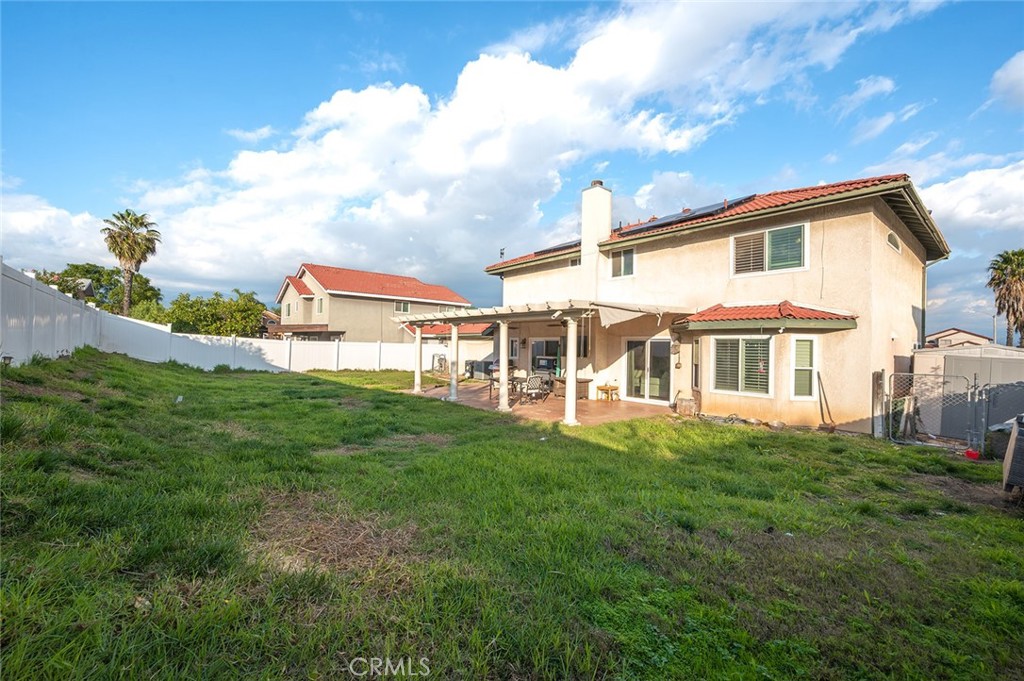 1790 North Encina Avenue Rialto, CA 92376 - Photo 36 of 47 a front view of a house with a garden