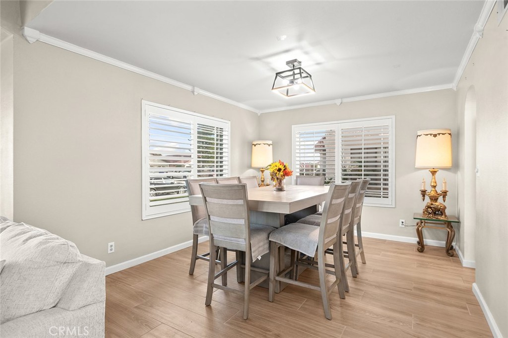 1790 North Encina Avenue Rialto, CA 92376 - Photo 7 of 47 a view of a dining room with furniture wooden floor and a chandelier