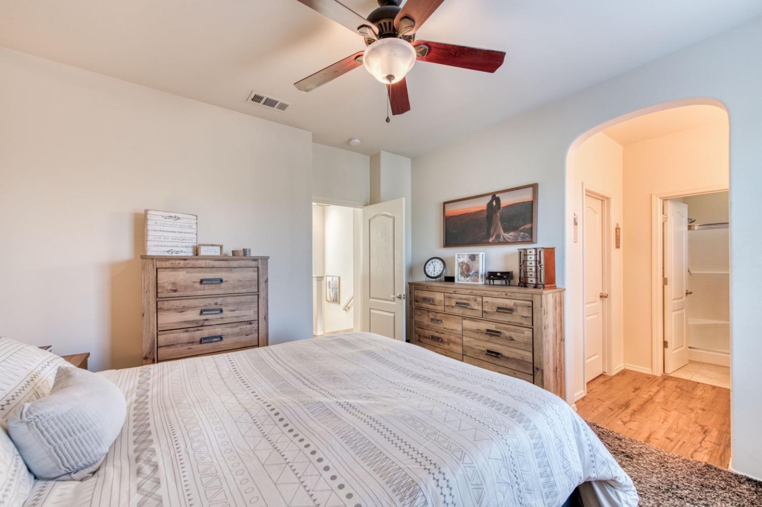 4085 Harlan Ranch Boulevard Clovis, CA 93619 - Photo 12 of 27 a bedroom with a bed and furniture