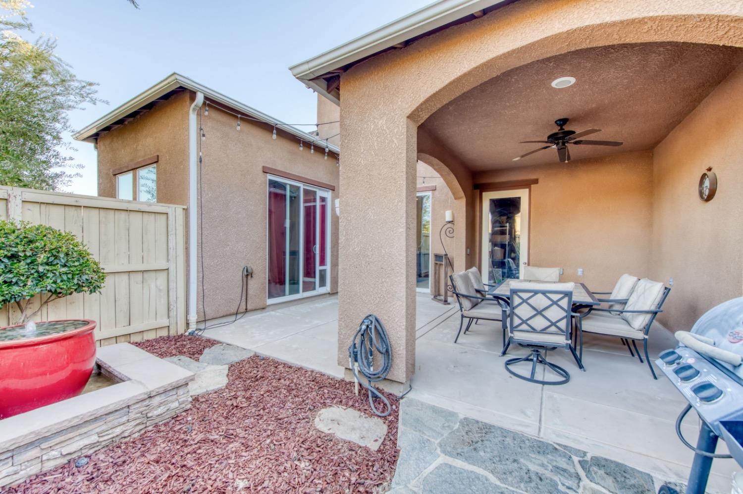 4085 Harlan Ranch Boulevard Clovis, CA 93619 - Photo 23 of 27 a view of a dinning table and chair in the patio