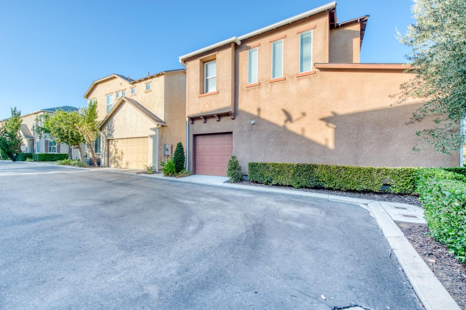 4085 Harlan Ranch Boulevard Clovis, CA 93619 - Photo 27 of 27 a front view of a house with a yard and garage