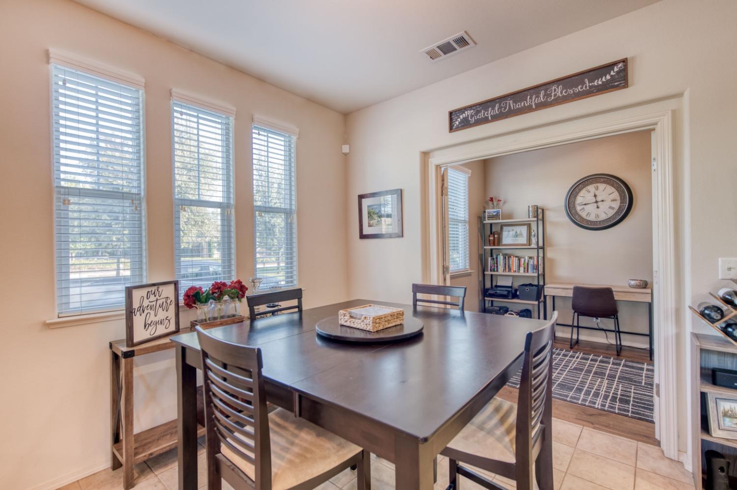 4085 Harlan Ranch Boulevard Clovis, CA 93619 - Photo 10 of 27 a living room with furniture and a large window