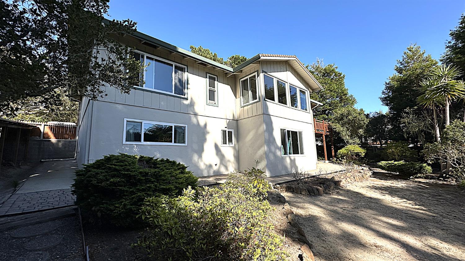 3076 Strawberry Hill Road Pebble Beach, CA 93953 - Photo 11 of 15 a front view of a house with a yard