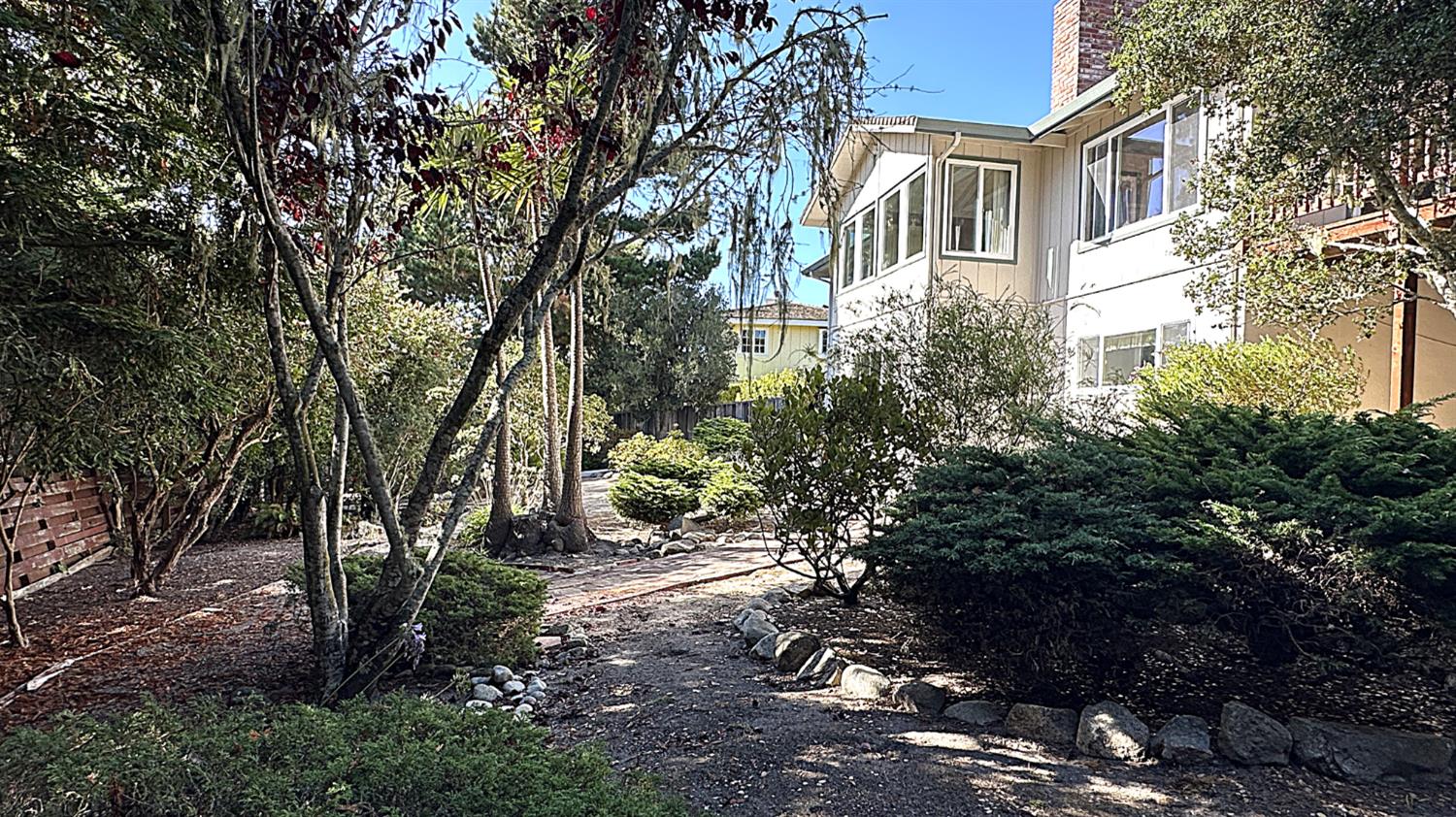 3076 Strawberry Hill Road Pebble Beach, CA 93953 - Photo 12 of 15 a view of a house with a yard