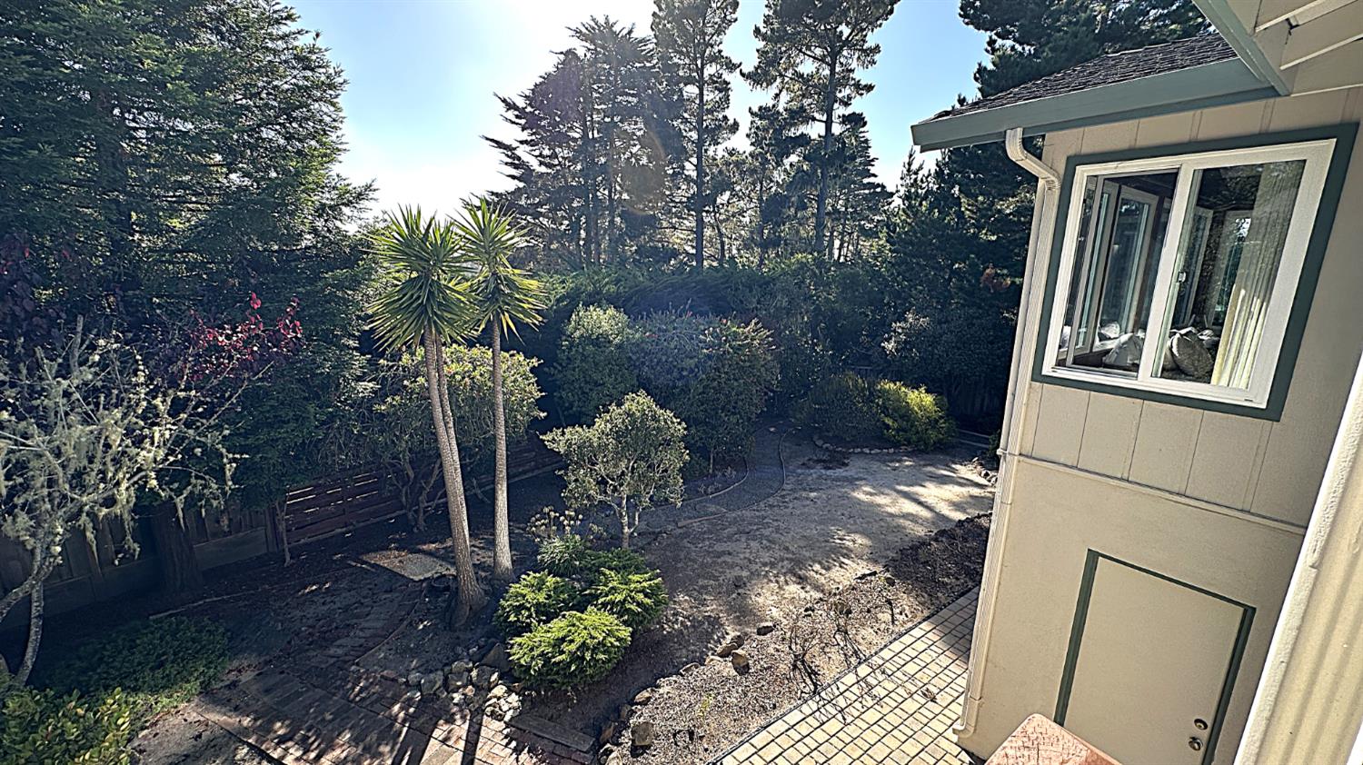 3076 Strawberry Hill Road Pebble Beach, CA 93953 - Photo 13 of 15 a view of a back yard with patio