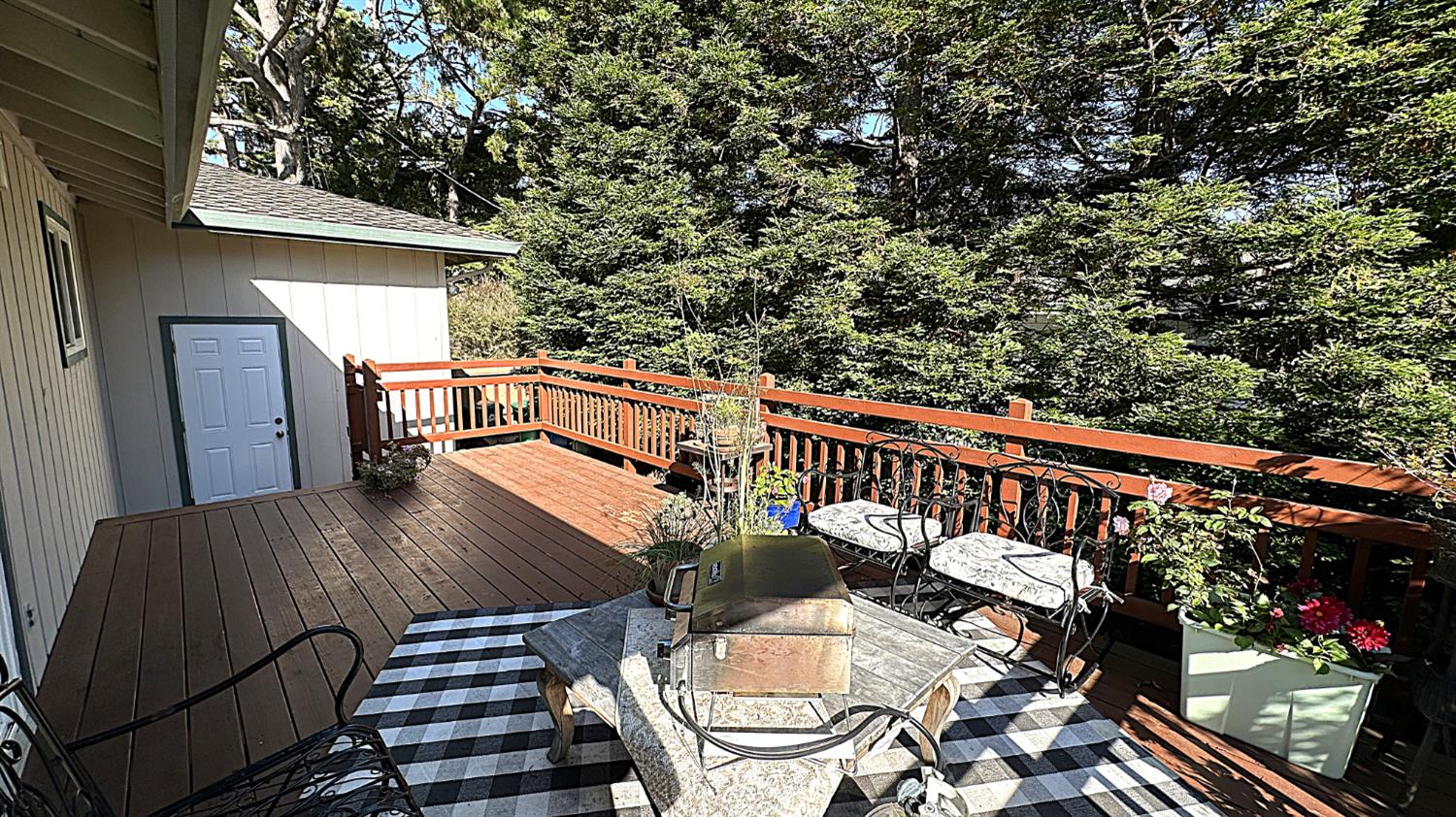 3076 Strawberry Hill Road Pebble Beach, CA 93953 - Photo 14 of 15 a balcony with wooden floor table and chairs