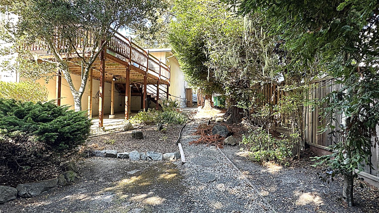 3076 Strawberry Hill Road Pebble Beach, CA 93953 - Photo 10 of 15 a view of a house with a yard