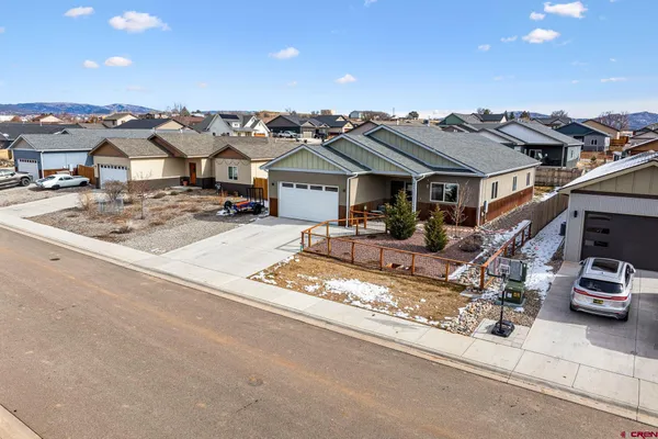 a view of a car park in front of house