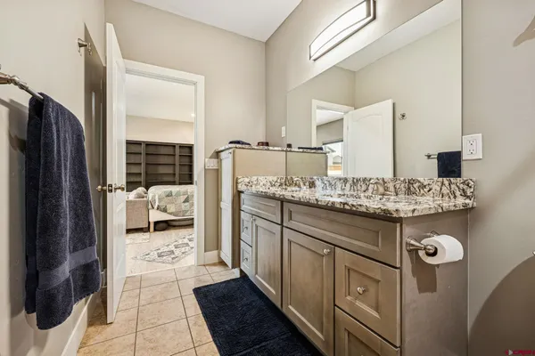 a bathroom with a sink double vanity and a mirror