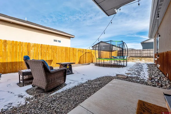 a view of swimming pool with outdoor seating