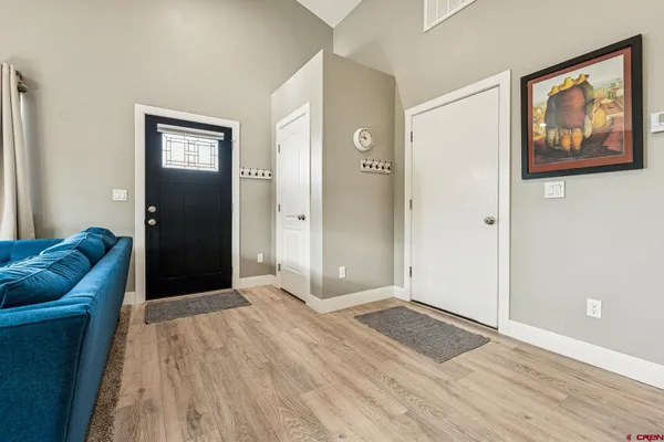a view of livingroom with hardwood floor and hallway