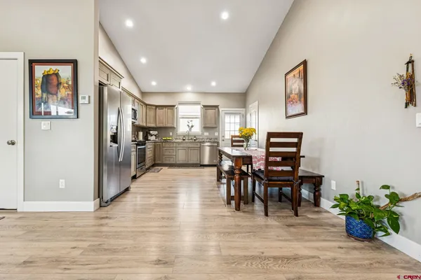 a view of a dining room with furniture window and wooden floor
