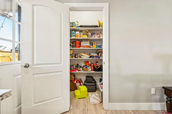 a view of storage and utility room with washer and dryer