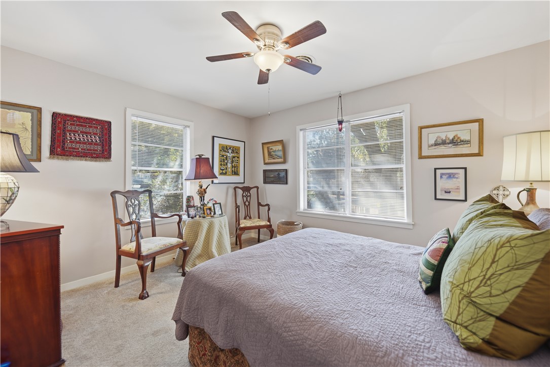 1703 South Day Street Brenham, TX 77833 - Photo 16 of 41 a bed room with a bed and a chair