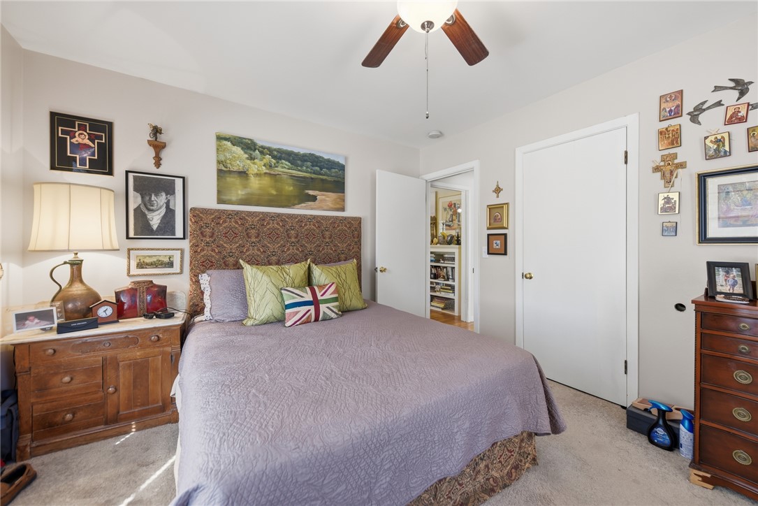 1703 South Day Street Brenham, TX 77833 - Photo 18 of 41 a bedroom with a bed and a dresser