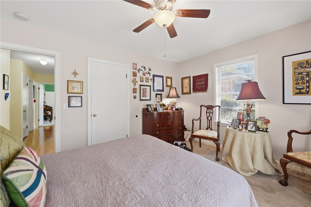 1703 South Day Street Brenham, TX 77833 - Photo 19 of 41 a bedroom with furniture and a bed
