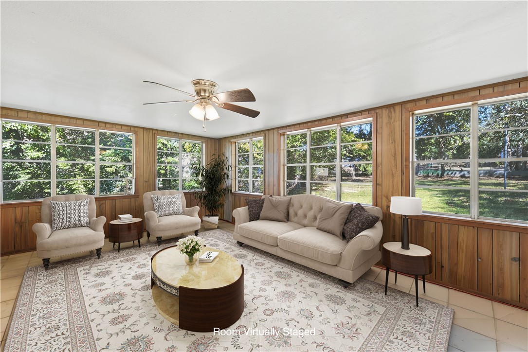 1703 South Day Street Brenham, TX 77833 - Photo 24 of 41 a living room with furniture and a large window
