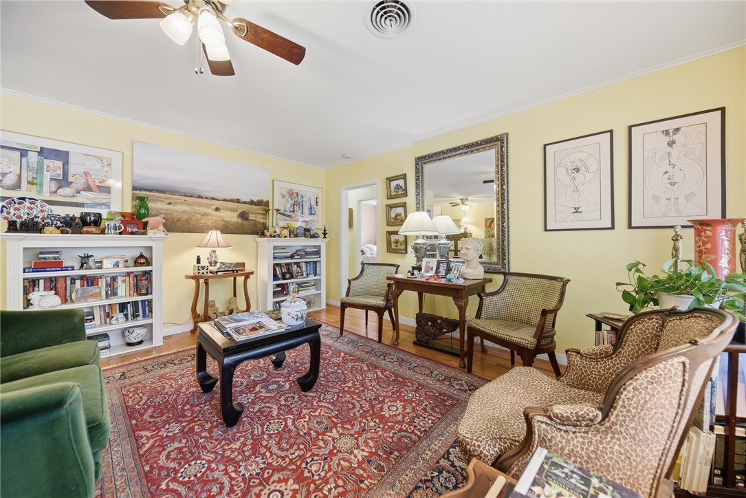 1703 South Day Street Brenham, TX 77833 - Photo 3 of 41 a living room with furniture and a rug