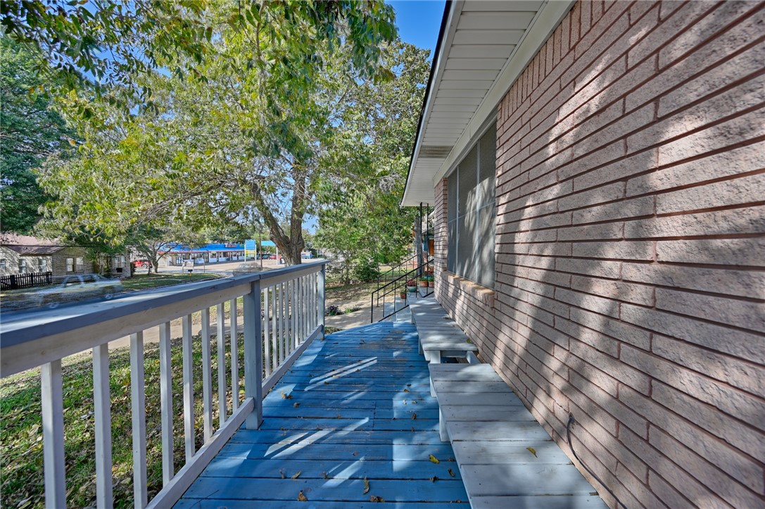 1703 South Day Street Brenham, TX 77833 - Photo 37 of 41 a view of a balcony with wooden floor