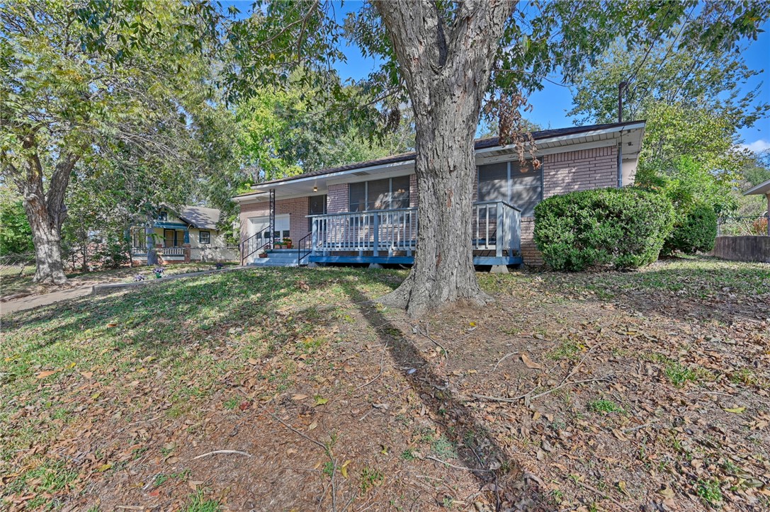 1703 South Day Street Brenham, TX 77833 - Photo 39 of 41 a view of a yard with a tree