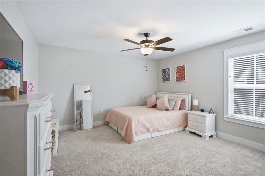318 Summerall Drive Anderson, SC 29621 - Photo 27 of 41 This inviting bedroom features a cozy bed and ample natural light, perfect for peaceful repose.