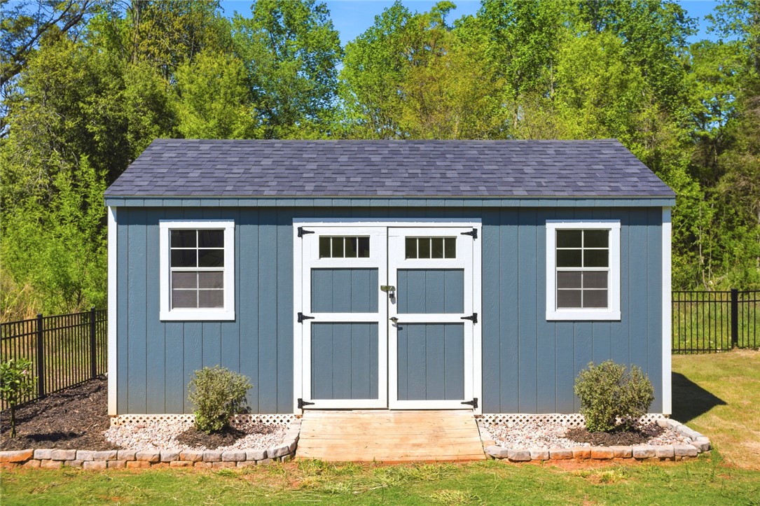 318 Summerall Drive Anderson, SC 29621 - Photo 39 of 41 This charming utility shed offers versatile storage solutions for any outdoor space.