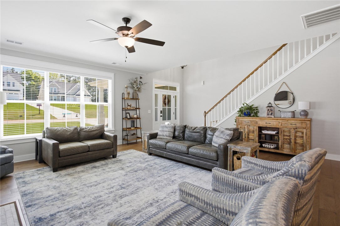 318 Summerall Drive Anderson, SC 29621 - Photo 5 of 41 This inviting living space features high ceilings and hardwood floors, creating an airy and elegant atmosphere.