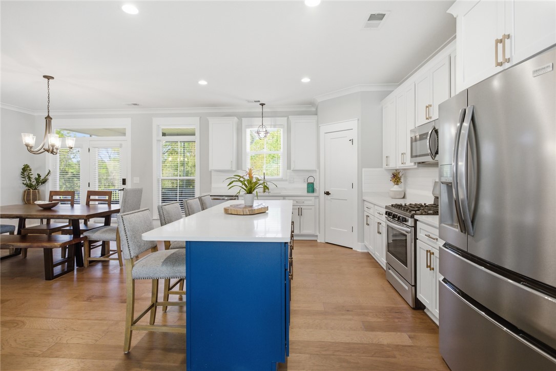 318 Summerall Drive Anderson, SC 29621 - Photo 8 of 41 Bright, open concept kitchen and dining area, ideal for gathering.