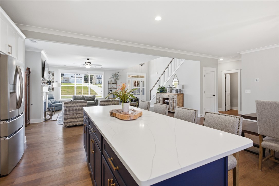 318 Summerall Drive Anderson, SC 29621 - Photo 9 of 41 This inviting space combines a functional kitchen island with seamless access to the living area.