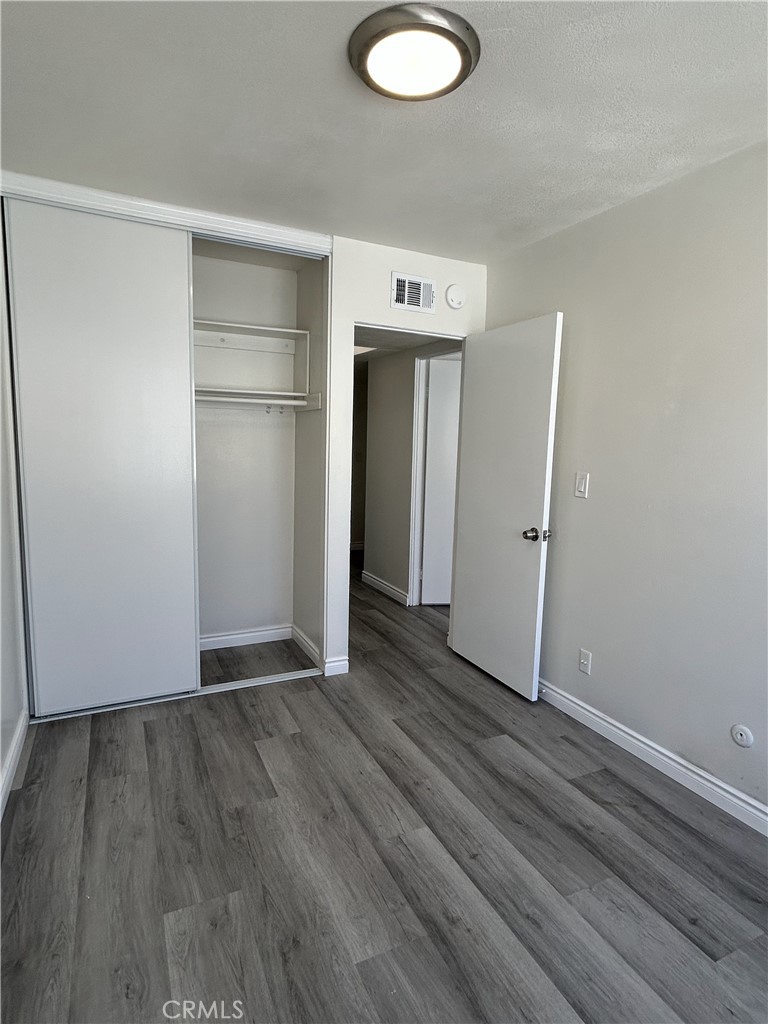400 South Garfield Avenue, Unit 5 Alhambra, CA 91801 - Photo 13 of 23 a view of an empty room with wooden floor and closet
