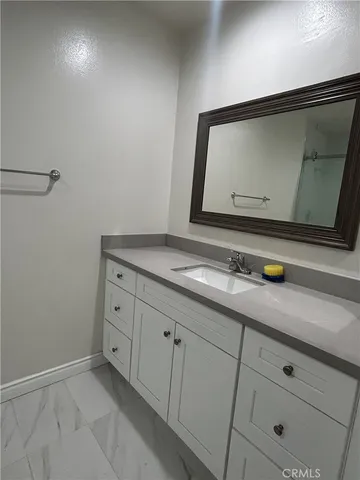 a bathroom with a sink and mirror