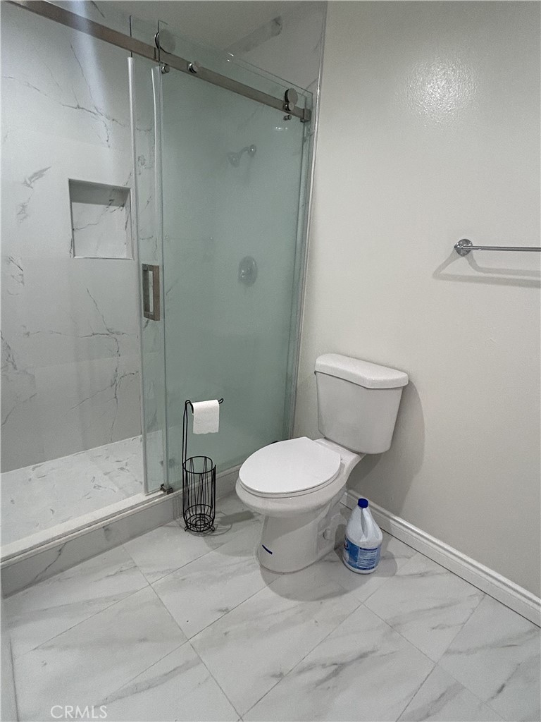 400 South Garfield Avenue, Unit 5 Alhambra, CA 91801 - Photo 17 of 23 a bathroom with a toilet sink and shower