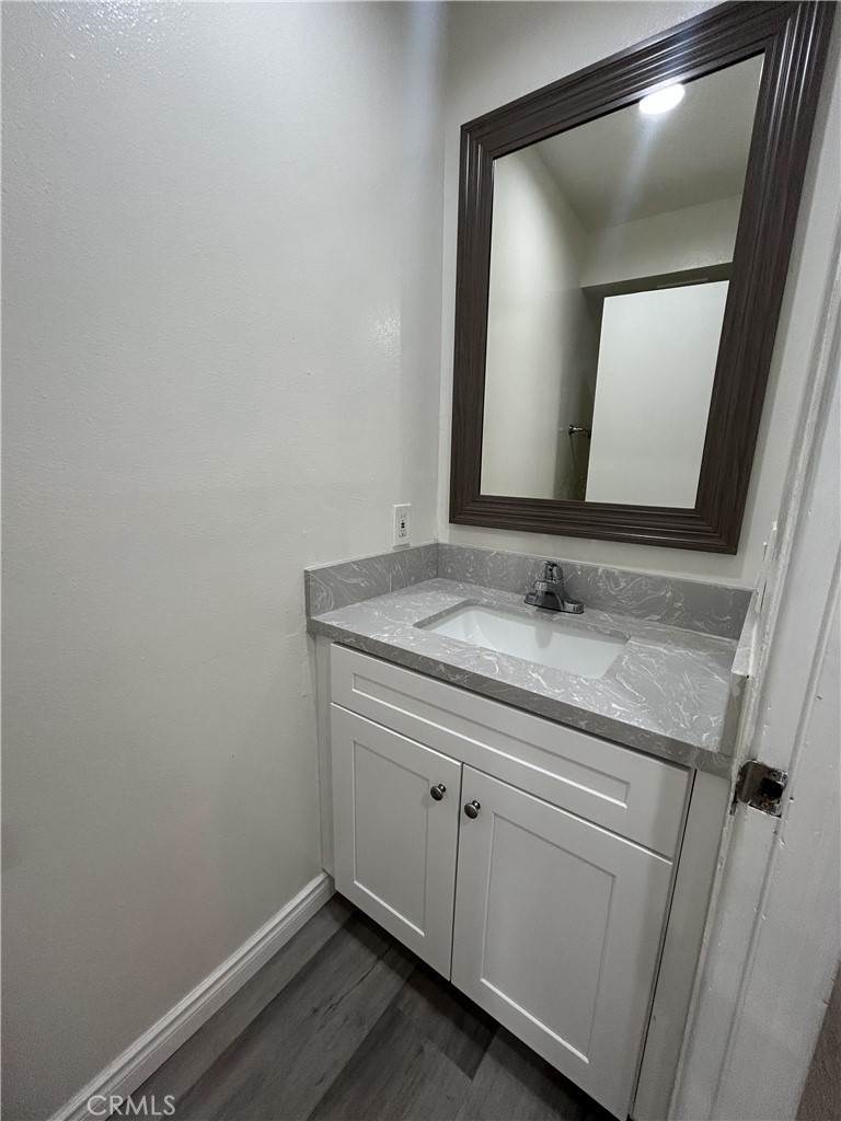 400 South Garfield Avenue, Unit 5 Alhambra, CA 91801 - Photo 8 of 23 a bathroom with a sink and a mirror