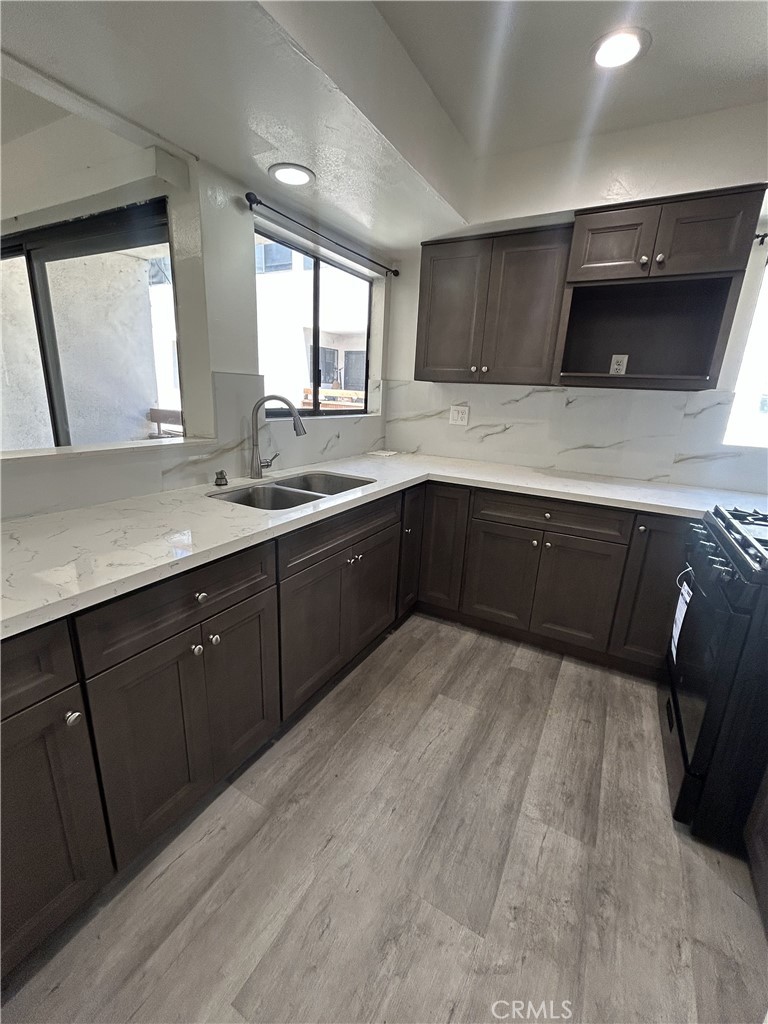 400 South Garfield Avenue, Unit 5 Alhambra, CA 91801 - Photo 9 of 23 a kitchen with a sink and a stove top oven