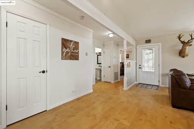 a kitchen that has a sink a stove and a chandelier