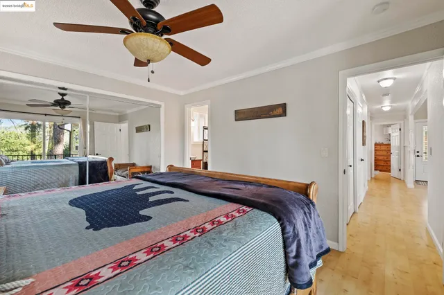 a bed room with a bed and a chandelier