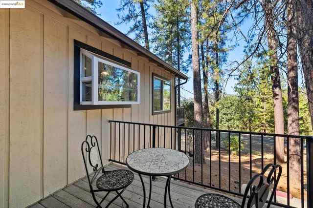 a view of a two chairs in the balcony
