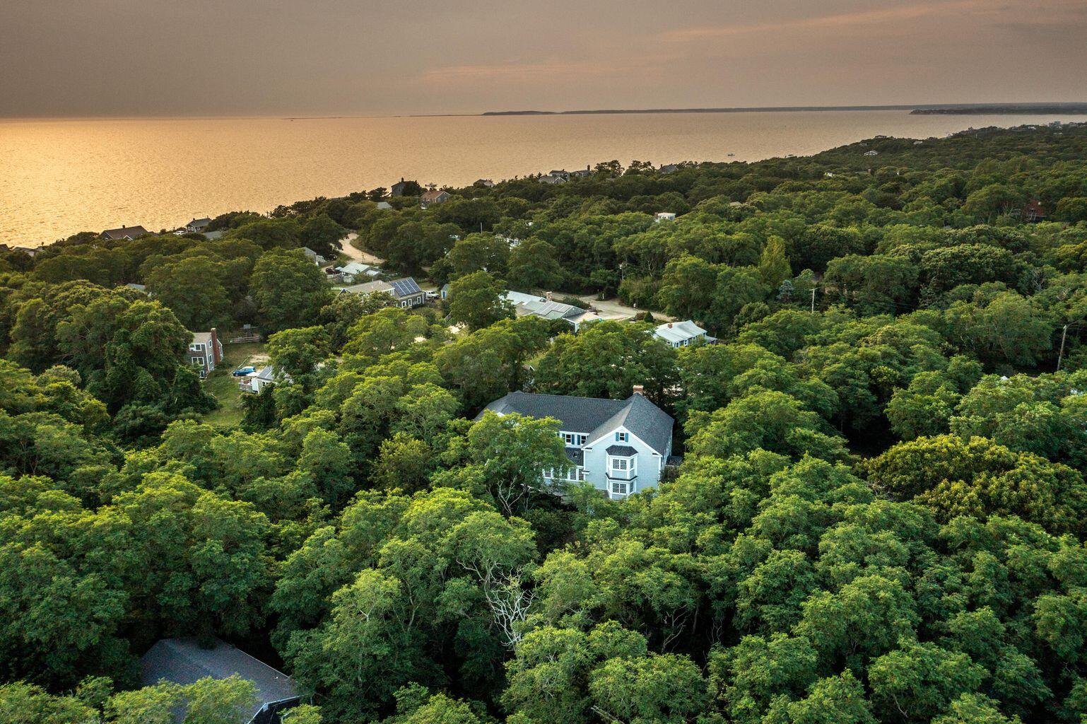 105 Townsend Avenue Eastham, MA 02642 - Photo 1 of 16 an aerial view of a houses with a yard and lake