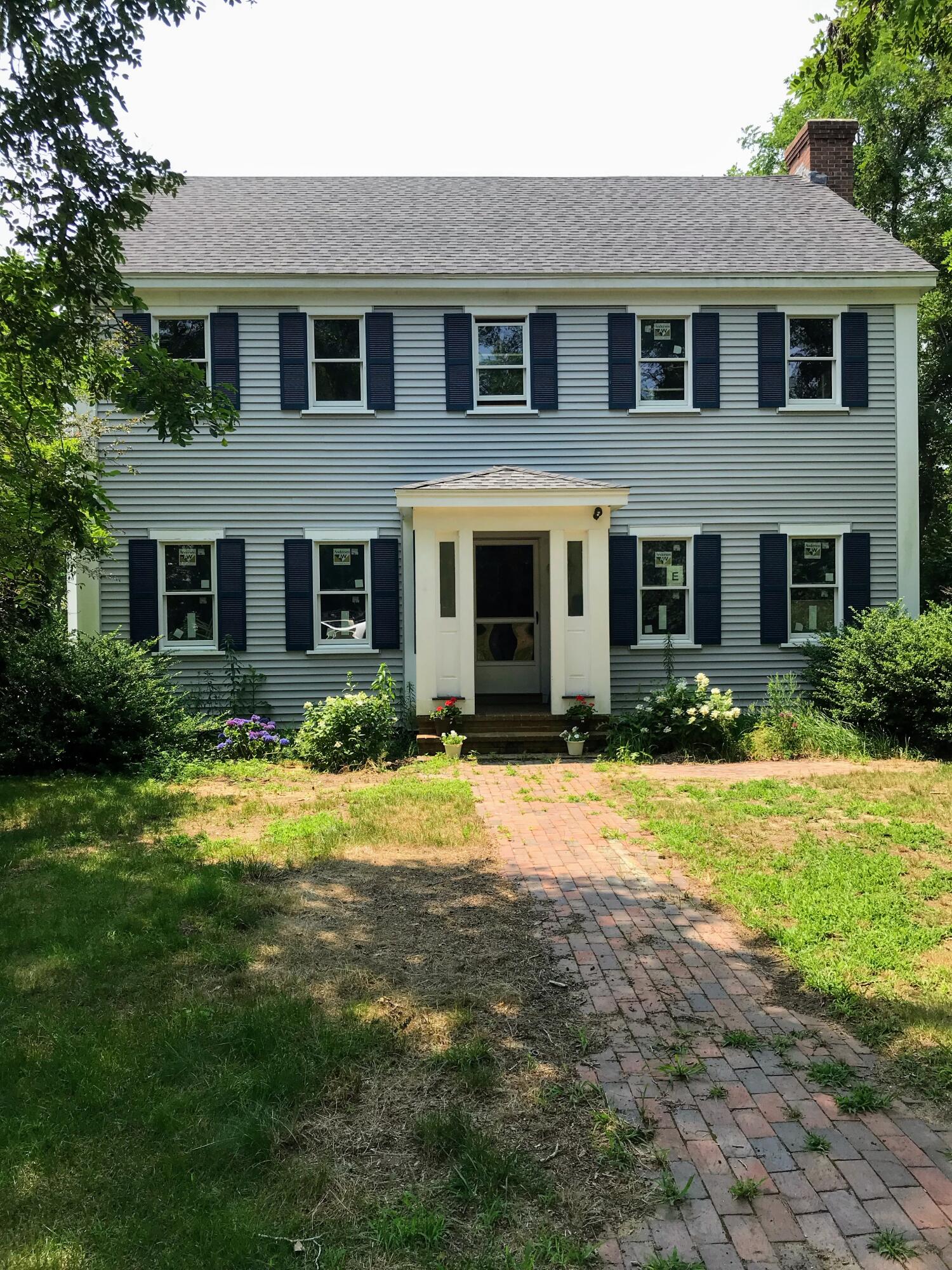 105 Townsend Avenue Eastham, MA 02642 - Photo 4 of 16 a front view of a house with a yard